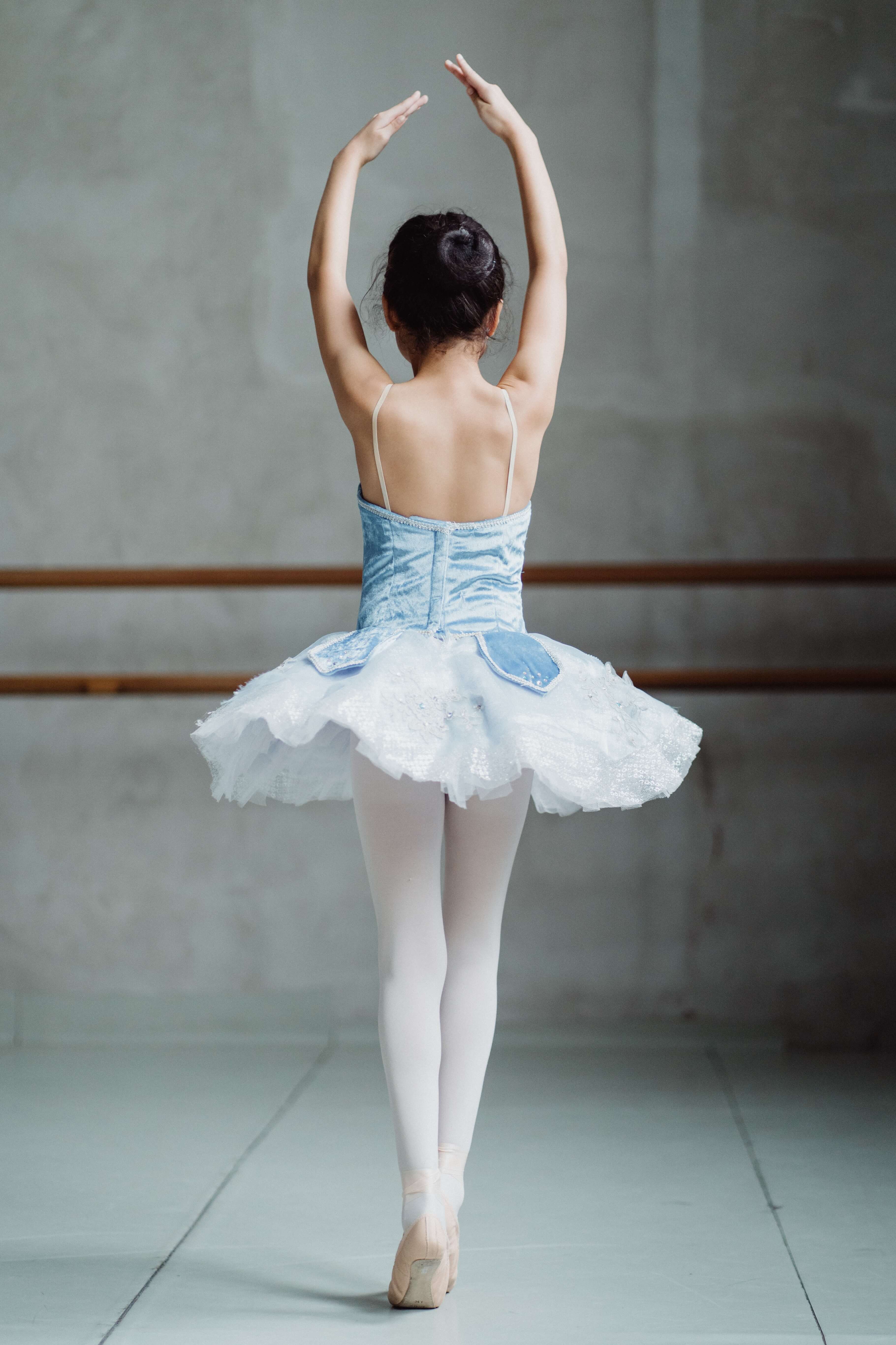 Ballerina dancing in dance studio child dancer